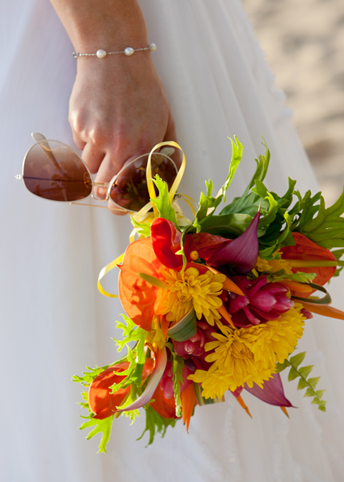 Colorful tropical bridal bouquet with sunglasses