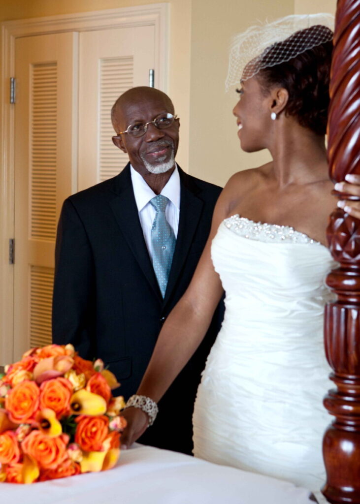 Bride sharing a quiet moment with her father before the wedding ceremony