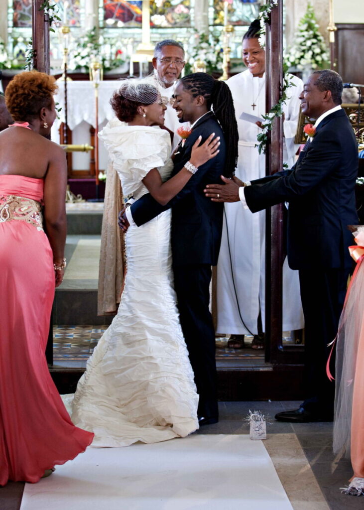 Newlyweds embracing at the altar during their church wedding ceremony